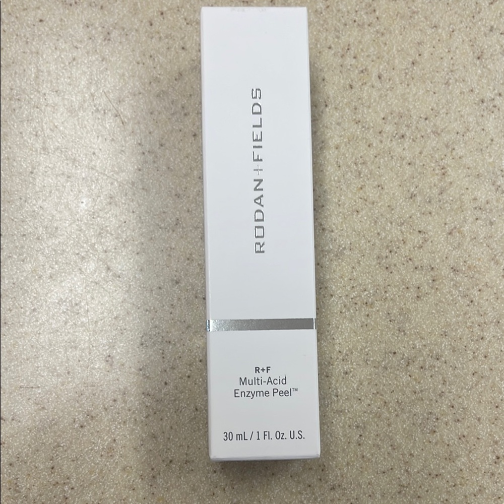 Rodan + Fields Skincare Product in White and Silver